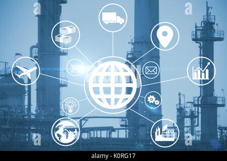 Composite image of globe amidst various icons against exterior of factory Stock Photo