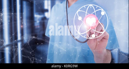Midsection of surgeon holding stethoscope against view of hospital corridor Stock Photo