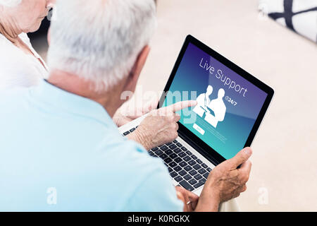 Human representations with live support text against focused senior couple using laptop Stock Photo