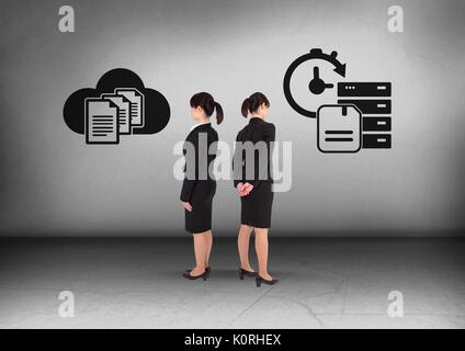 Digital composite of Computer file storage options with Businesswoman looking in opposite directions Stock Photo