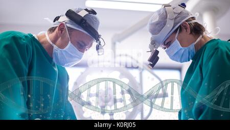 Digital composite of Doctors standing with 3D DNA strands Stock Photo