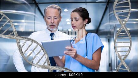 Digital composite of Doctors standing with 3D DNA strands Stock Photo