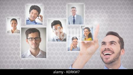 Digital composite of Businessman interacting and choosing a person from group of people interface Stock Photo