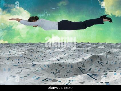 Digital composite of Businesswoman flying over sea of documents under green sky clouds Stock Photo