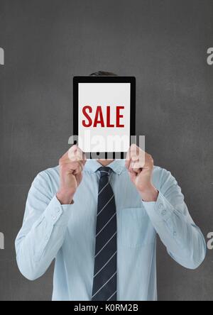Digital composite of Business man holding a tablet with sale text Stock Photo