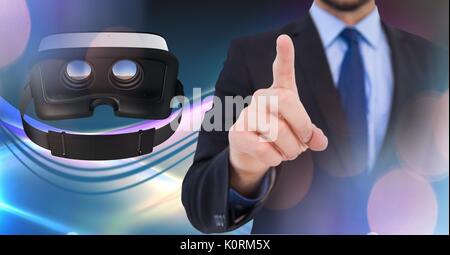 Digital composite of Man touching and interacting with virtual reality headset with transition effect Stock Photo