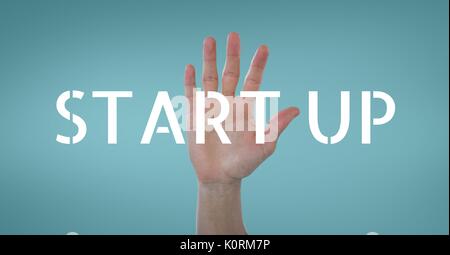 Digital composite of Hand interacting with start-up business text against blue background Stock Photo