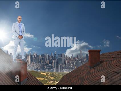 Digital composite of Businessman standing on Roofs with chimney and city Stock Photo