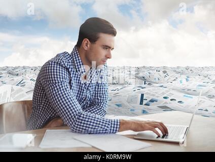 Digital composite of Businessman at desk in sea of documents under sky clouds Stock Photo