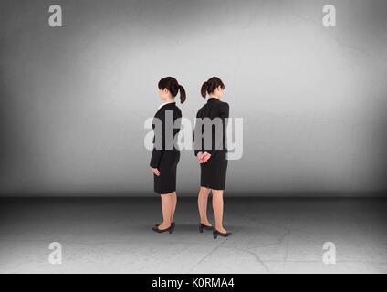 Digital composite of Businesswoman looking in opposite directions Stock Photo