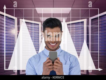 Digital composite of Happy business man holding a phone and graphics in server room Stock Photo