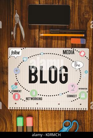Digital composite of Table top with a notebook with web graphics Stock Photo