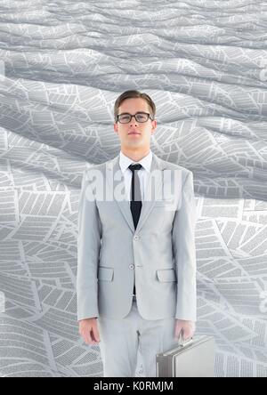 Digital composite of Geeky Businessman in sea of documents with briefcase Stock Photo