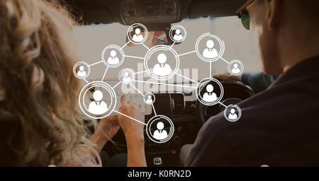 Digital composite of Interface against couple in the car Stock Photo