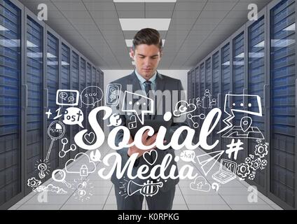 Digital composite of Business man holding a tablet and graphics in server room Stock Photo
