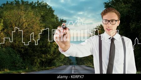 Digital composite of Man drawing a city on the road Stock Photo
