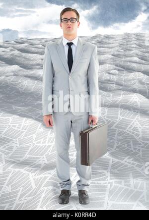 Digital composite of Businessman in sea of documents under sky clouds with briefcase Stock Photo