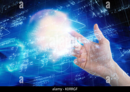 Hand of man pretending to touch an invisible screen against low angle view of digitally generated image of mathematical problems Stock Photo
