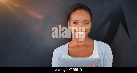 Silhouette of up arrow sign against front view of a black woman looking at camera Stock Photo