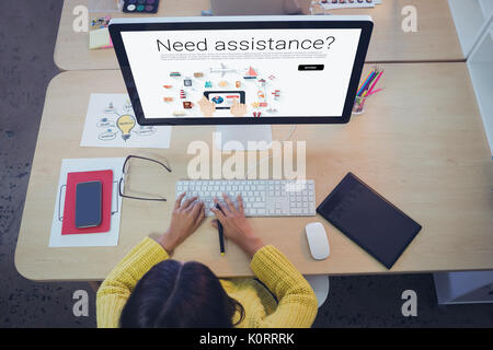 Icons with need assistance text against female graphic designer working in creative office Stock Photo