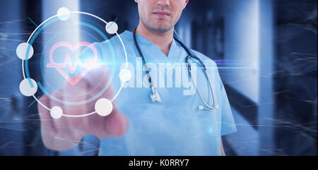 Surgeon pretending to be using futuristic digital screen against vacant corridor Stock Photo