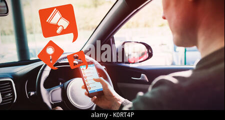 Digital image of icons against man looking at gps on his phone Stock Photo