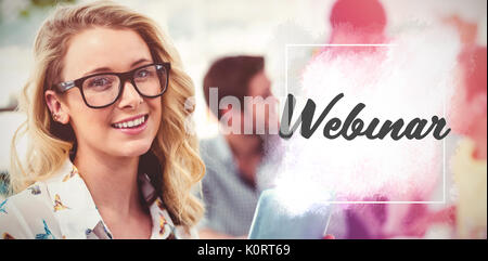 Webinar text against white background  against creative business team working hard together Stock Photo
