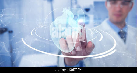 Doctor pretending to be using futuristic digital screen against medical examination room Stock Photo