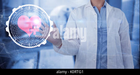 Midsection of female doctor using digital screen against doctor scanning patient on machine Stock Photo