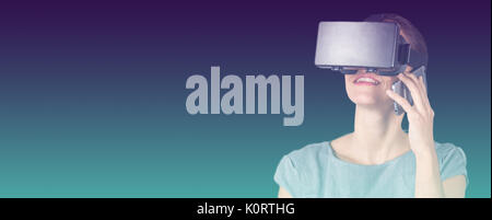 Happy woman talking on mobile phone while using virtual reality headset against turquoise and purple background Stock Photo