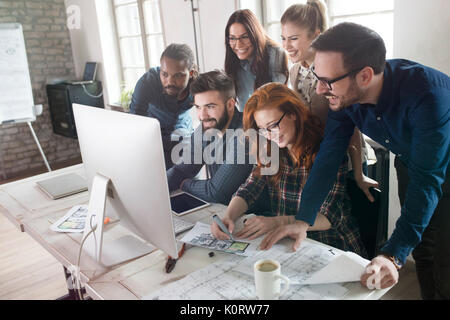 Group of young designers working as team Stock Photo