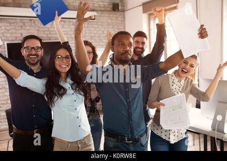 Group picture of young successful team of designers Stock Photo