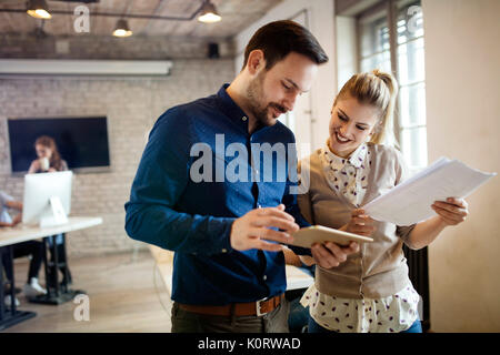 Picture of young designers using tablet in office Stock Photo