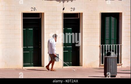 Blind man using walking stick Mahon Menorca Minorca Stock Photo