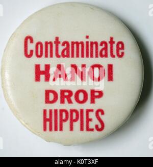 Contaminate Hanoi, Drop Hippies, a sarcastic pro Vietnam War pin responding to concerns about Agent Orange chemical contamination of the city of Hanoi, Vietnam by suggesting that America contaminate the city by sending anti war hippie protesters there, 1965.