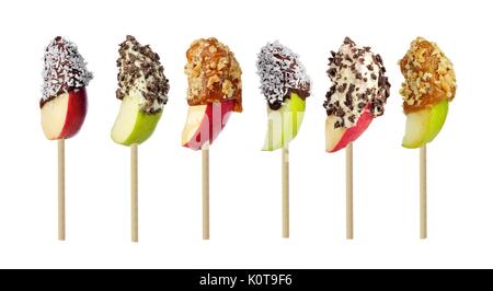 Mixed candy dipped apple slices isolated on a white background Stock Photo