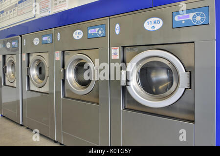 Front loading washers and dryer‘s in commercial laundromat, United