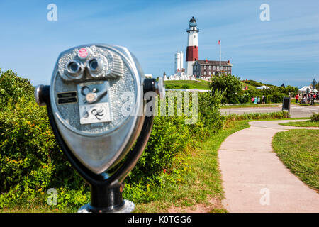 Montauk point lighthouse and vintage binocular in front, Long Island Stock Photo