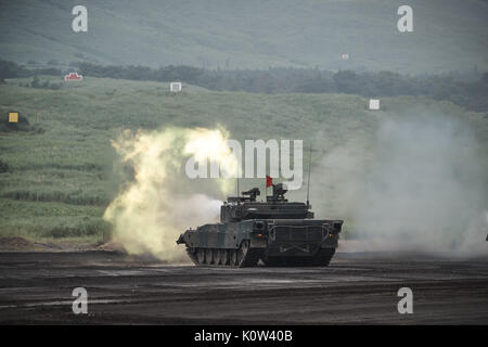 Gotemba, Japan. 24th Aug, 2017. A Japanese Ground Self-Defense Force's new Type 10 armoured tank fires shell durging an annual training session at Higashifuji training field in Gotemba, west of Tokyo. About 2,400 JGSDF personnel with some 80 tanks and armoured vehicles participated in the drill, taking place also on 24 and 25 August. Credit: Aflo Co. Ltd./Alamy Live News Stock Photo