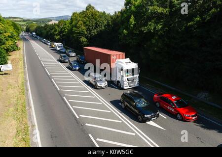 Bridpirt, Dorset, UK. 25th Aug, 2017. UK Weather. Queuing traffic on the A35 Bridport bypass in Dorset on the friday before the August bank holiday as holidaymakers hit the roads as the weather is forecast to be warm and sunny. Photo Credit: Graham Hunt/Alamy Live News Stock Photo