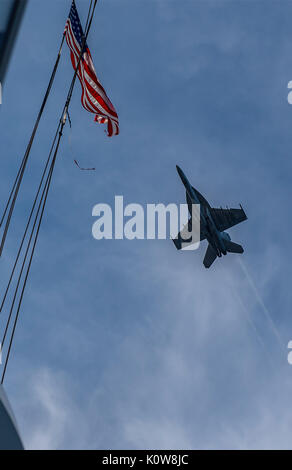 170821-N-GT324-052 ATLANTIC OCEAN (Aug. 21, 2017) An F/A-18 Super Hornet, assigned to Carrier Air Wing 1, flies over the flight deck of USS Harry S. Truman (CVN 75). Truman is currently underway conducting Flight Deck Certifications in preparation for future operations. (U.S. Navy photo by Lt. j.g. Marc Rockwell-Pate/Released) Stock Photo