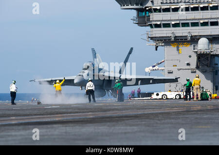 170821-N-PE636-488  ATLANTIC OCEAN (Aug. 21, 2017) Sailors position an F/A-18F Super Hornet assigned to the “Checkmates' of Strike Fighter Squadron (VFA) 211 prior to its launch from the aircraft carrier USS Harry S. Truman (CVN 75). Harry S. Truman is underway conducting flight deck certifications in preparation for future operations. (U.S. Navy photo by Mass Communication Specialist 2nd Class Anthony Flynn/Released) Stock Photo