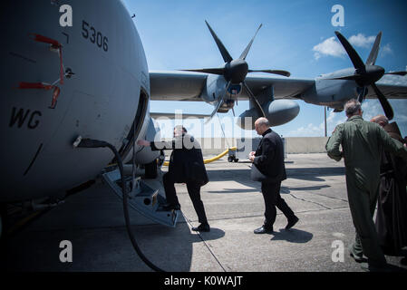 The Bishop of Biloxi, Bishop Louis Kihneman, boards a WC-130J Super Hercules aircraft Aug. 17, 2017 at Keesler Air Force Base Mississippi. Kihneman visited the 403rd Wing to learn more about its mission and during his visit took a moment to bless the wing's fleet of aircraft. (U.S. Air Force photo/Staff Sgt. Heather Heiney) Stock Photo