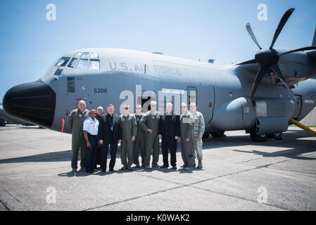 The Bishop of Biloxi, Bishop Louis Kihneman, and members of the 53rd Weather Reconnaissance Squadron, pose for a photo in front of a WC-130J Super Hercules aircraft Aug. 17, 2017 at Keesler Air Force Base, Mississippi. Kihneman visited the 403rd Wing to learn more about its mission and during his visit took a moment to bless the wing's fleet of aircraft.  (U.S. Air Force photo/Staff Sgt. Heather Heiney) Stock Photo