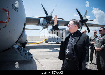 The Bishop of Biloxi, Bishop Louis Kihneman, blesses the 403rd Wing's fleet of aircraft Aug. 17, 2017 at Keesler Air Force Base, Mississippi. Kihneman visited the 403rd Wing to learn more about its mission. (U.S. Air Force photo/Staff Sgt. Heather Heiney) Stock Photo