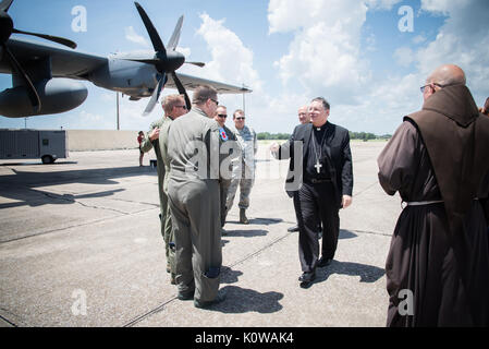 The Bishop of Biloxi, Bishop Louis Kihneman, blesses the 403rd Wing's fleet of aircraft Aug. 17, 2017 at Keesler Air Force Base, Mississippi. Kihneman visited the 403rd Wing to learn more about its mission. (U.S. Air Force photo/Staff Sgt. Heather Heiney) Stock Photo