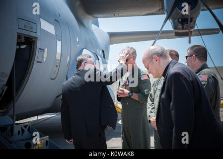 The Bishop of Biloxi, Bishop Louis Kihneman, blesses the 403rd Wing's fleet of aircraft Aug. 17, 2017 at Keesler Air Force Base, Mississippi. Kihneman visited the 403rd Wing to learn more about its mission. (U.S. Air Force photo/Staff Sgt. Heather Heiney) Stock Photo