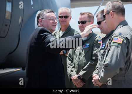 The Bishop of Biloxi, Bishop Louis Kihneman, blesses the 403rd Wing's fleet of aircraft Aug. 17, 2017 at Keesler Air Force Base, Mississippi. Kihneman visited the 403rd Wing to learn more about its mission. (U.S. Air Force photo/Staff Sgt. Heather Heiney) Stock Photo