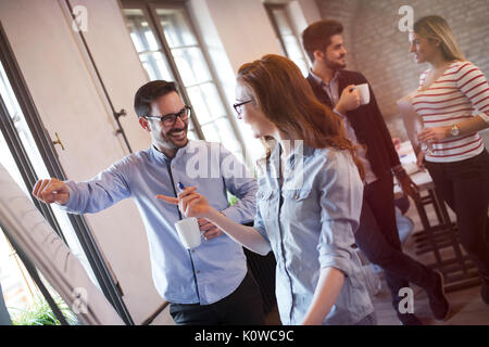 Portrait of architects discussing and drawing on board Stock Photo
