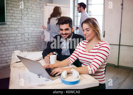 Two young perspective architects working on laptop Stock Photo